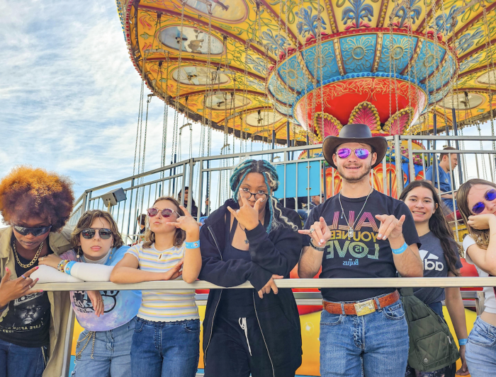 Far Out: Gael beach goers pose for a quick photo while waiting in line to ride the Sea Swings at the Santa Cruz Beach Boardwalk on Sunday, Sept 15. / Photo Courtesy of Hector Garcia ‘28